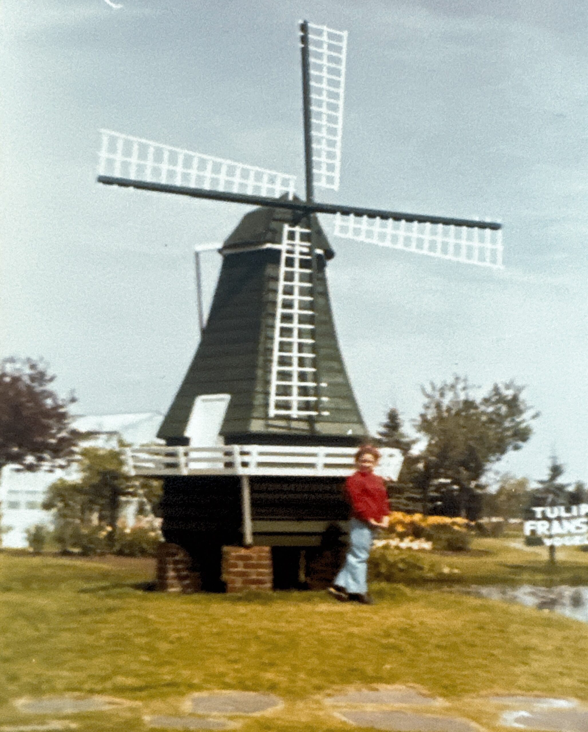Young Jenny in front a windmill in the Netherlands, 1980